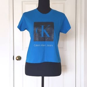 NWT. Calvin Klein 100% Cotton Cropped Short Sleeve Tee with painted front logo.
